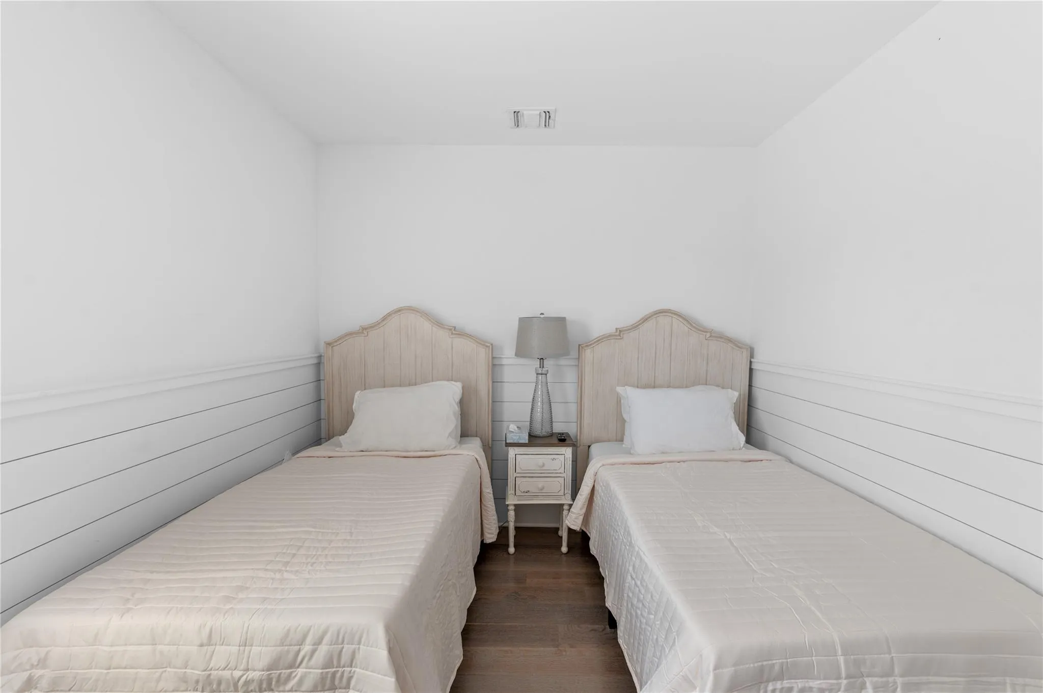 Bedroom with dark hardwood / wood-style flooring Bedroom with dark hardwood / wood-style flooring
