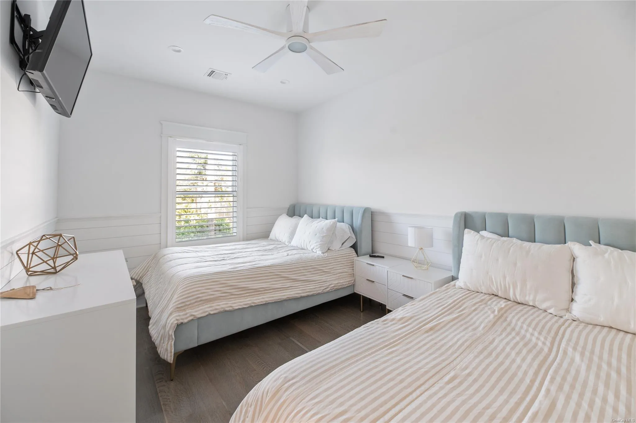 Bedroom featuring dark wood-type flooring and ceiling fan Bedroom featuring dark wood-type flooring and ceiling fan