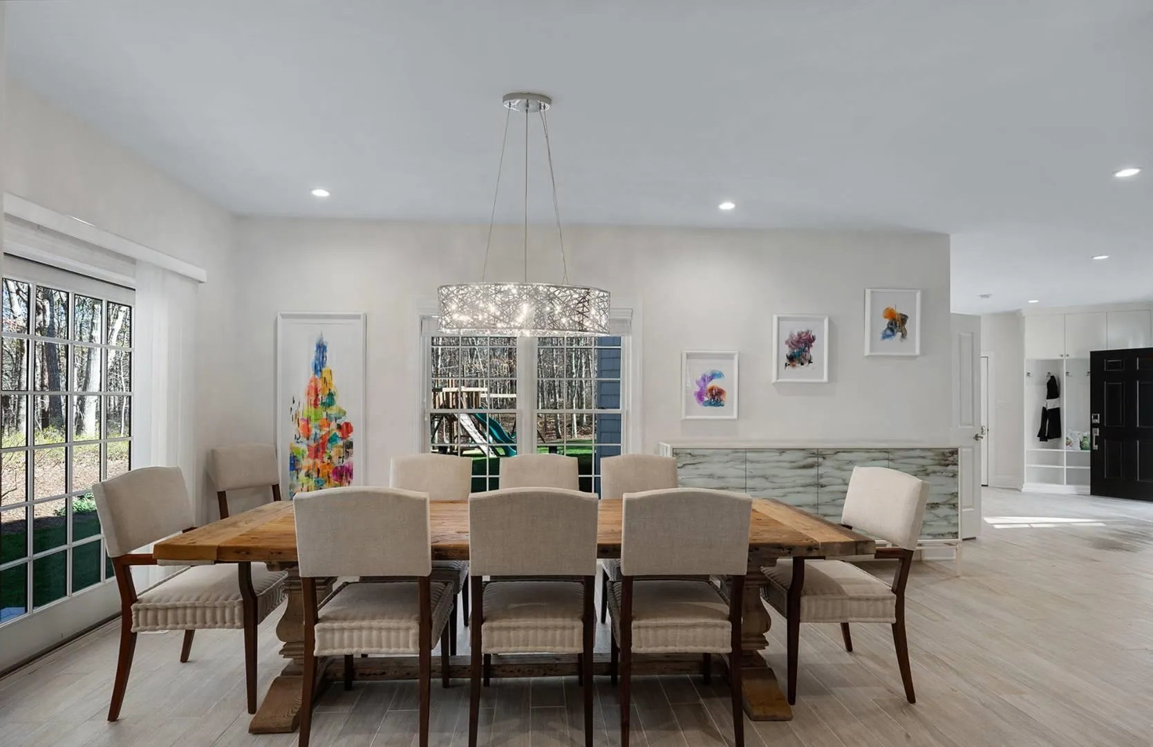 Dining space with light wood-type flooring and recessed lighting Dining space with light wood-type flooring and recessed lighting