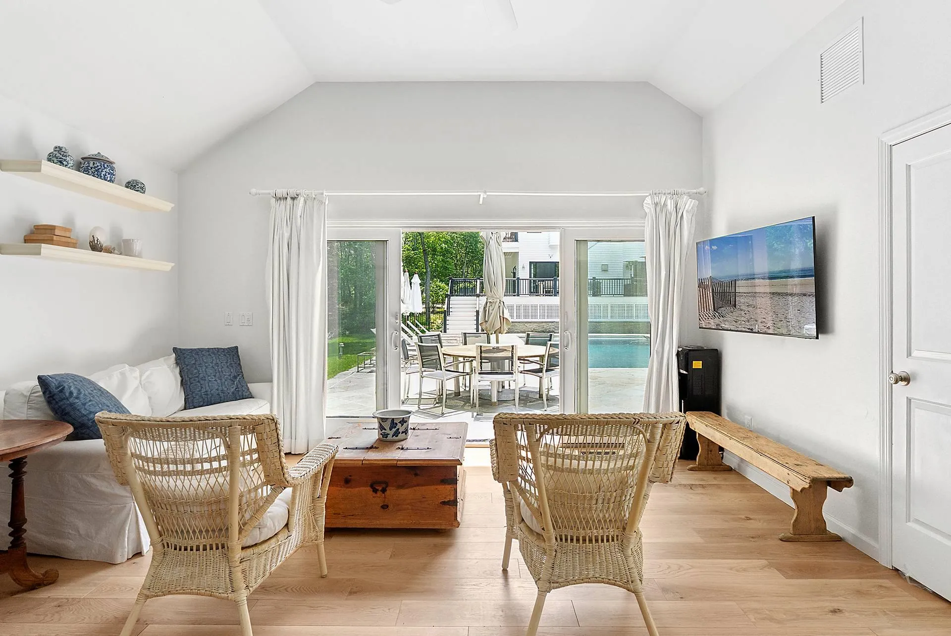 Sitting room featuring lofted ceiling and light wood-type flooring Sitting room featuring lofted ceiling and light wood-type flooring
