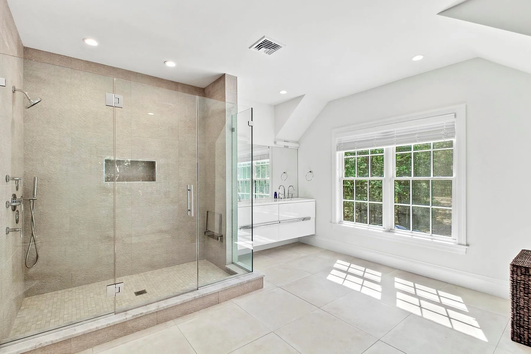 Bathroom featuring a stall shower, vanity, tile patterned flooring, recessed lighting, and lofted ceiling Bathroom featuring a stall shower, vanity, tile patterned flooring, recessed lighting, and lofted ceiling