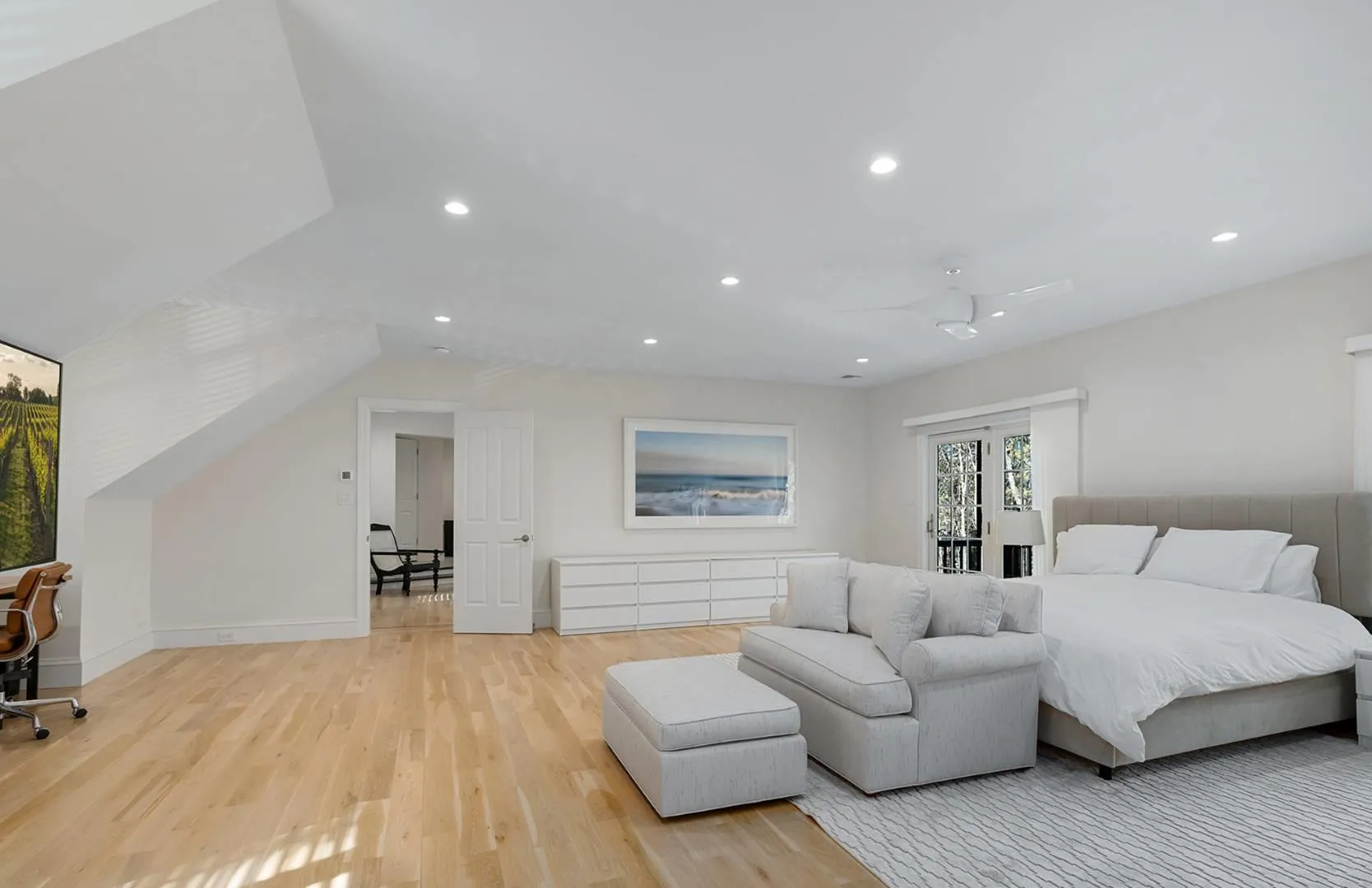 Bedroom with light wood-style flooring and recessed lighting Bedroom with light wood-style flooring and recessed lighting