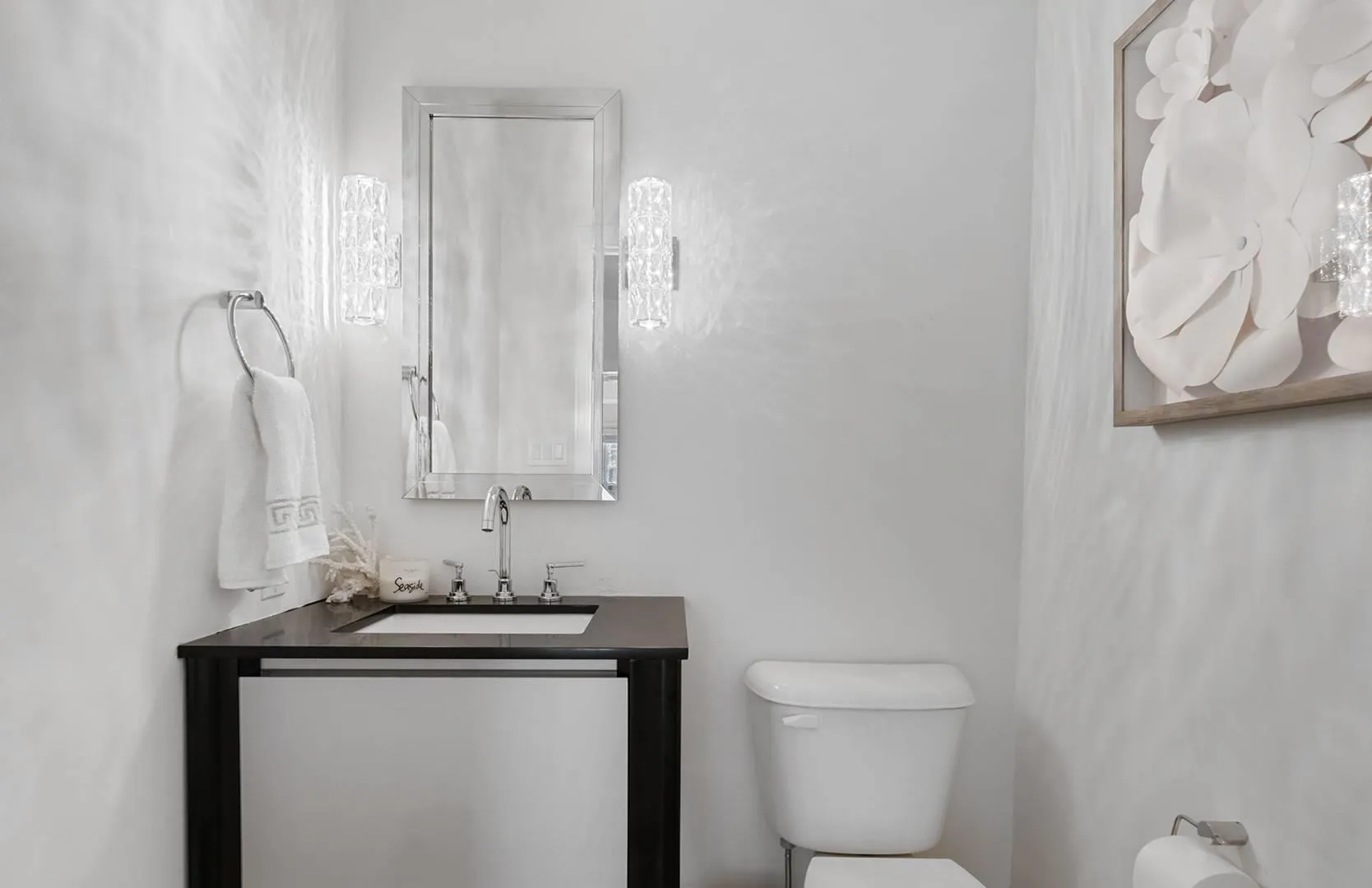 Half bathroom featuring toilet and vanity Half bathroom featuring toilet and vanity