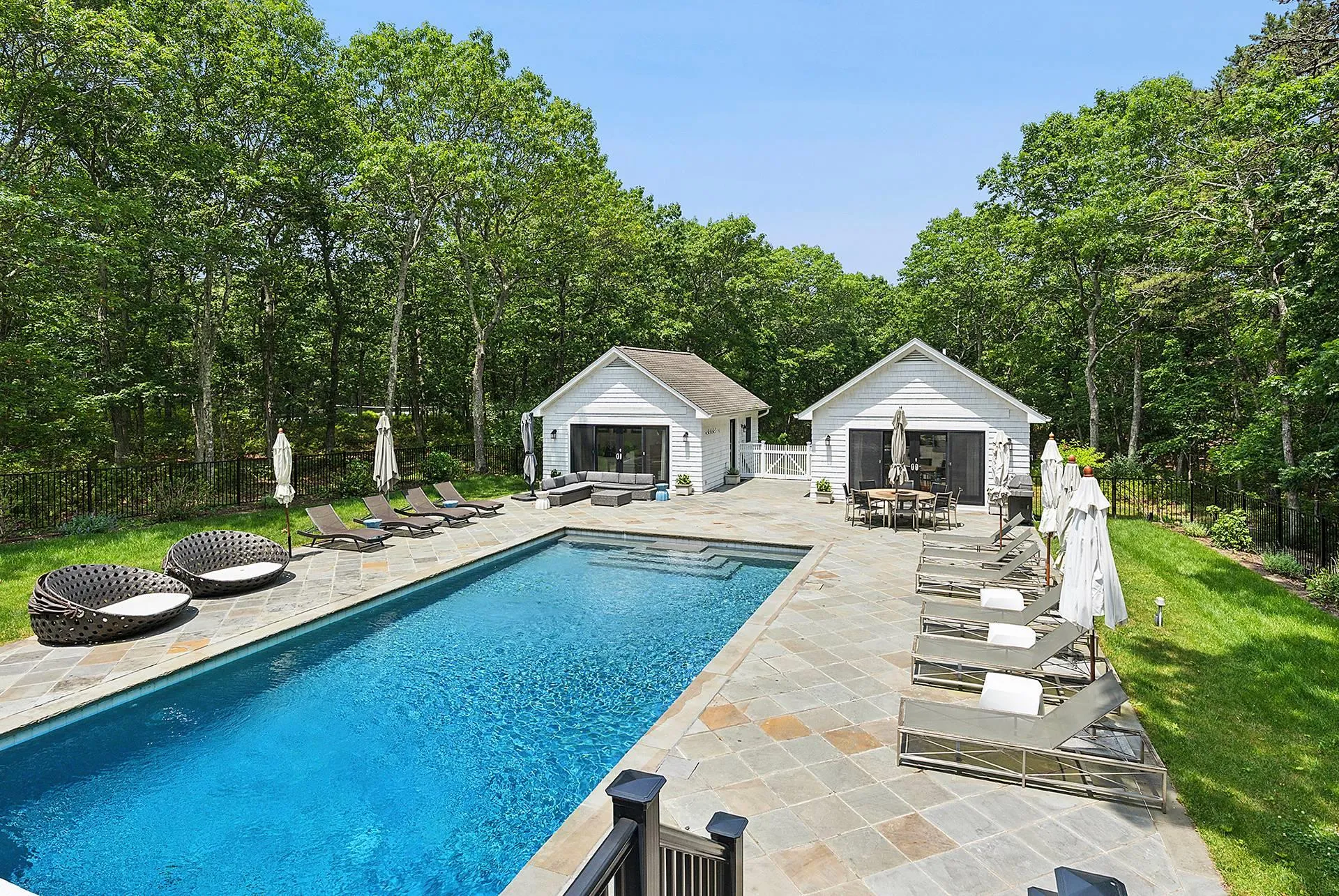 View of pool featuring a storage structure, a patio, an outdoor structure, and an outdoor living space View of pool featuring a storage structure, a patio, an outdoor structure, and an outdoor living space