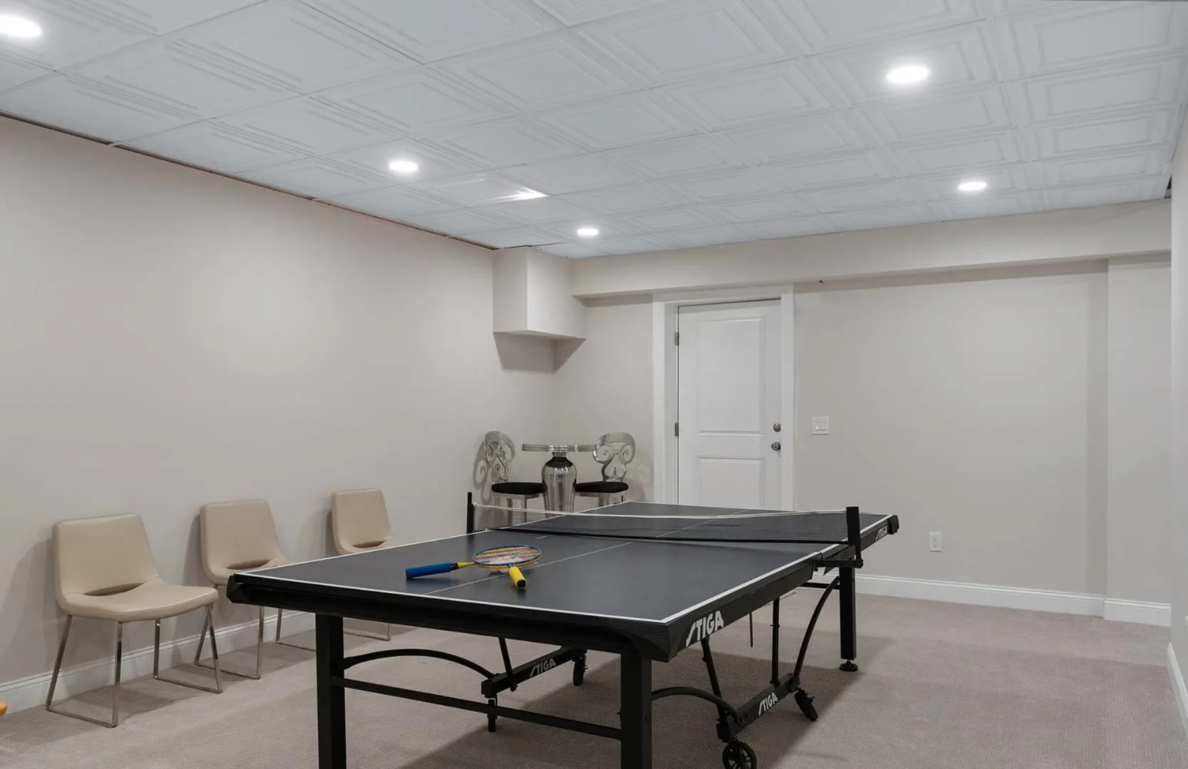 Rec room with recessed lighting, light colored carpet, and an ornate ceiling Rec room with recessed lighting, light colored carpet, and an ornate ceiling