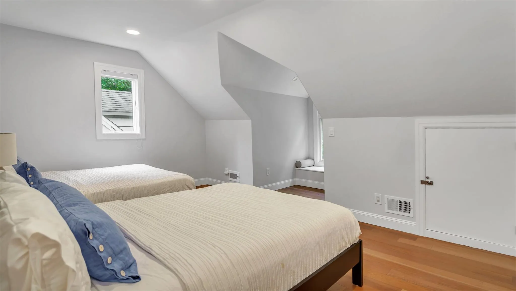 Bedroom with hardwood / wood-style flooring and vaulted ceiling Bedroom with hardwood / wood-style flooring and vaulted ceiling