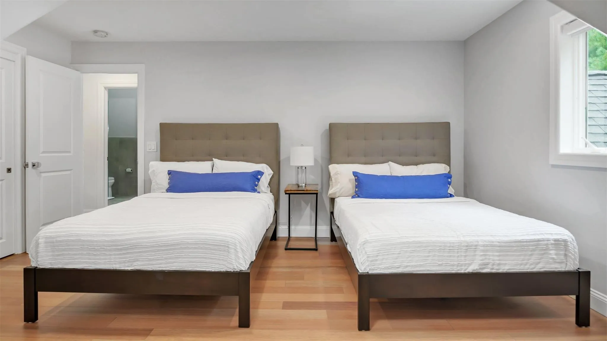 Bedroom featuring light hardwood / wood-style flooring Bedroom featuring light hardwood / wood-style flooring