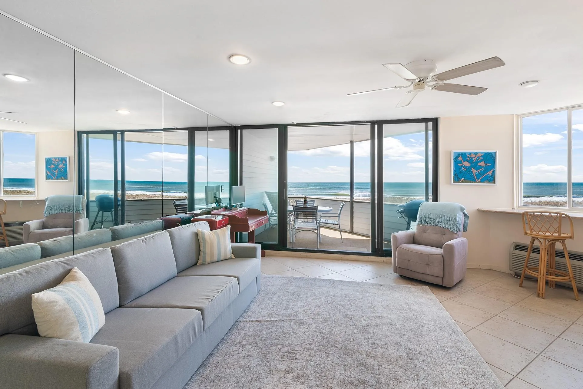 Tiled living area with a wealth of natural light, floor to ceiling windows, ceiling fan, and recessed lighting Tiled living area with a wealth of natural light, floor to ceiling windows, ceiling fan, and recessed lighting