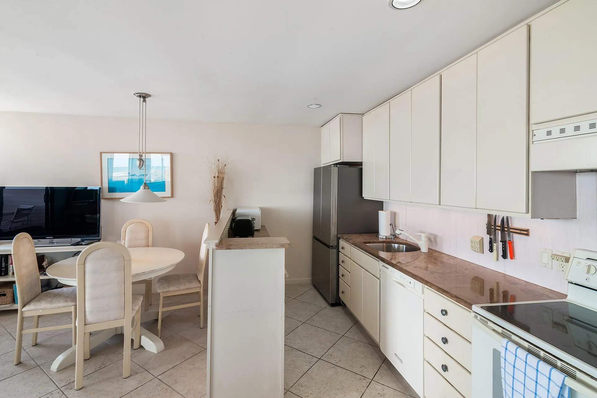 Kitchen with new stainless steel refrigerator Kitchen with new stainless steel refrigerator
