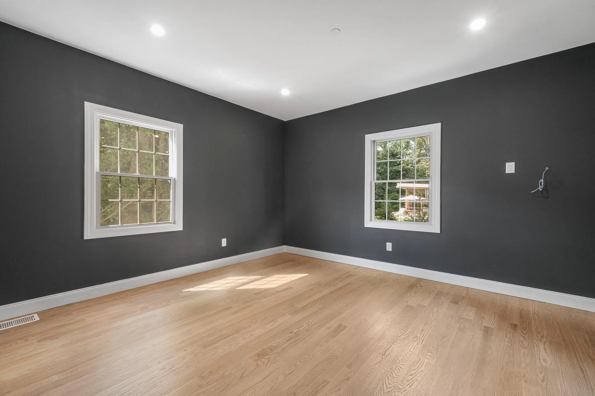 Empty room with light wood-type flooring Empty room with light wood-type flooring