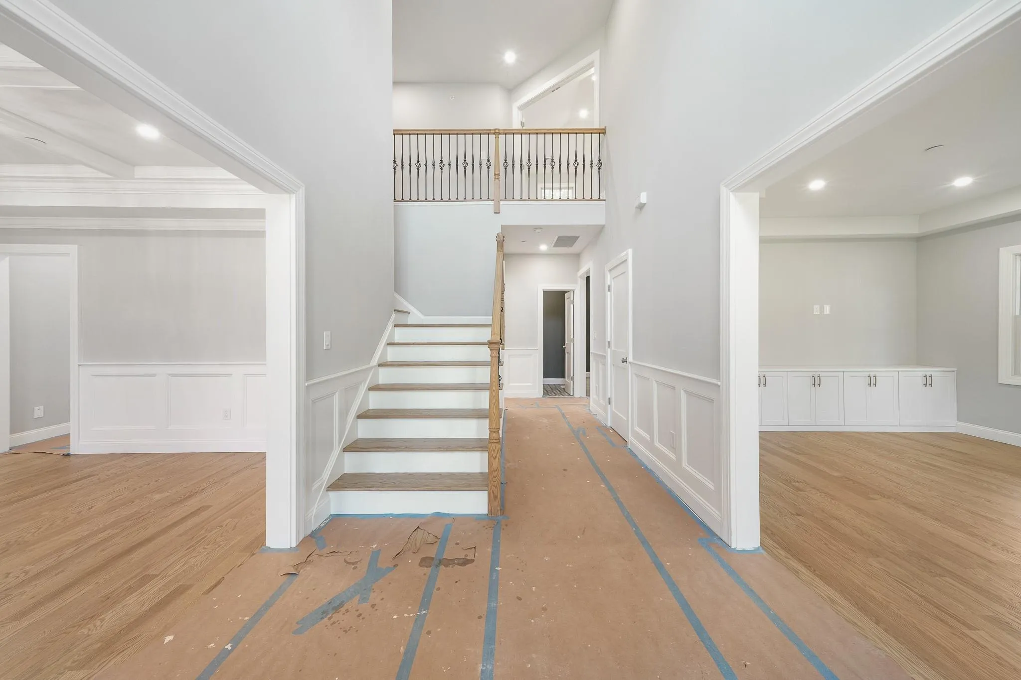 Stairs featuring hardwood / wood-style floors Stairs featuring hardwood / wood-style floors