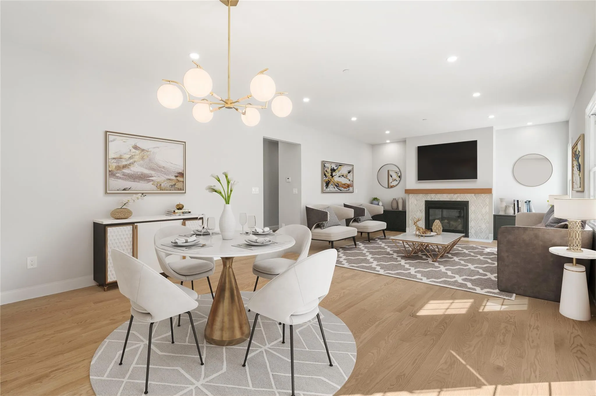 Dining space with an inviting chandelier, a high end fireplace, and light hardwood / wood-style flooring Dining space with an inviting chandelier, a high end fireplace, and light hardwood / wood-style flooring