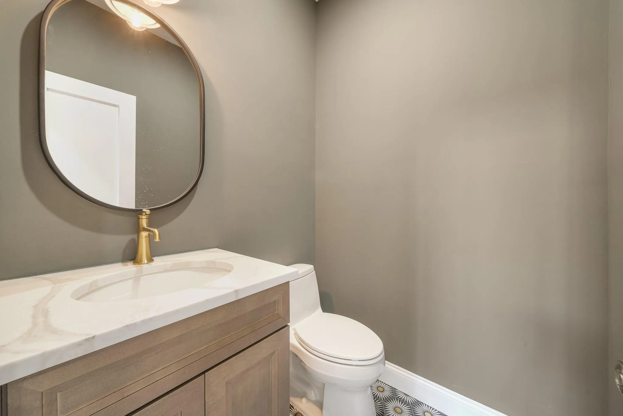 Bathroom featuring vanity and toilet Bathroom featuring vanity and toilet