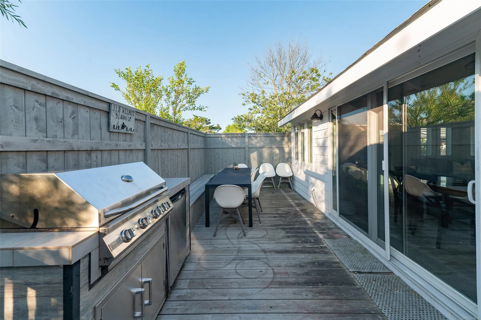 View of patio / terrace featuring area for grilling, a deck, and grilling area View of patio / terrace featuring area for grilling, a deck, and grilling area