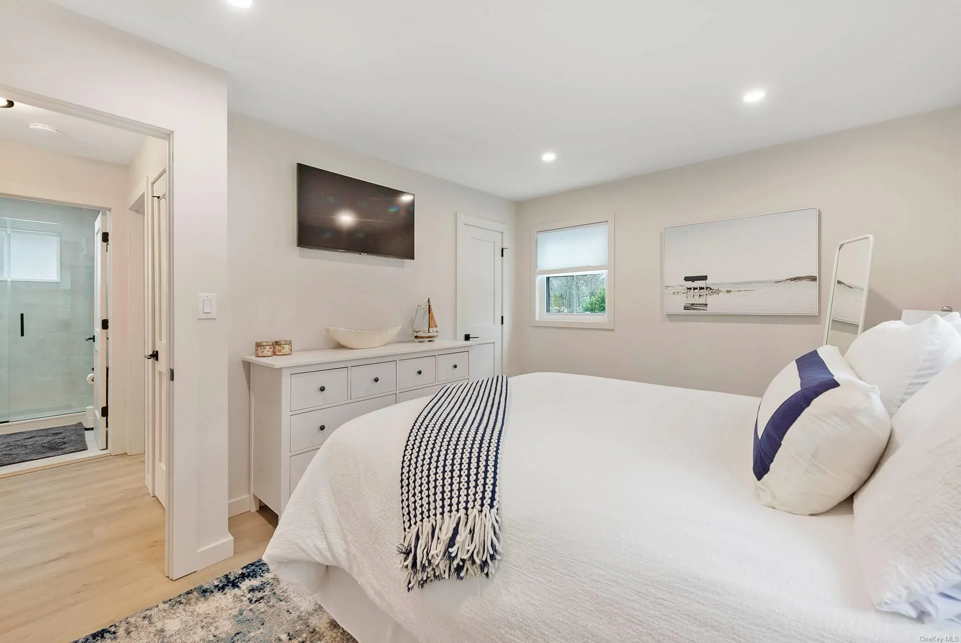 Bedroom with light wood-style flooring, recessed lighting, and baseboards Bedroom with light wood-style flooring, recessed lighting, and baseboards