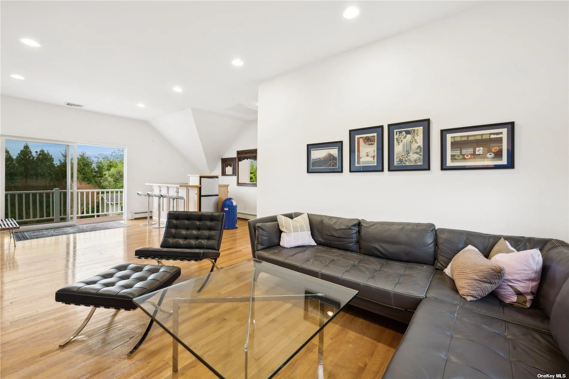 Wall of sliders open to 2nd floor deck Wall of sliders open to 2nd floor deck