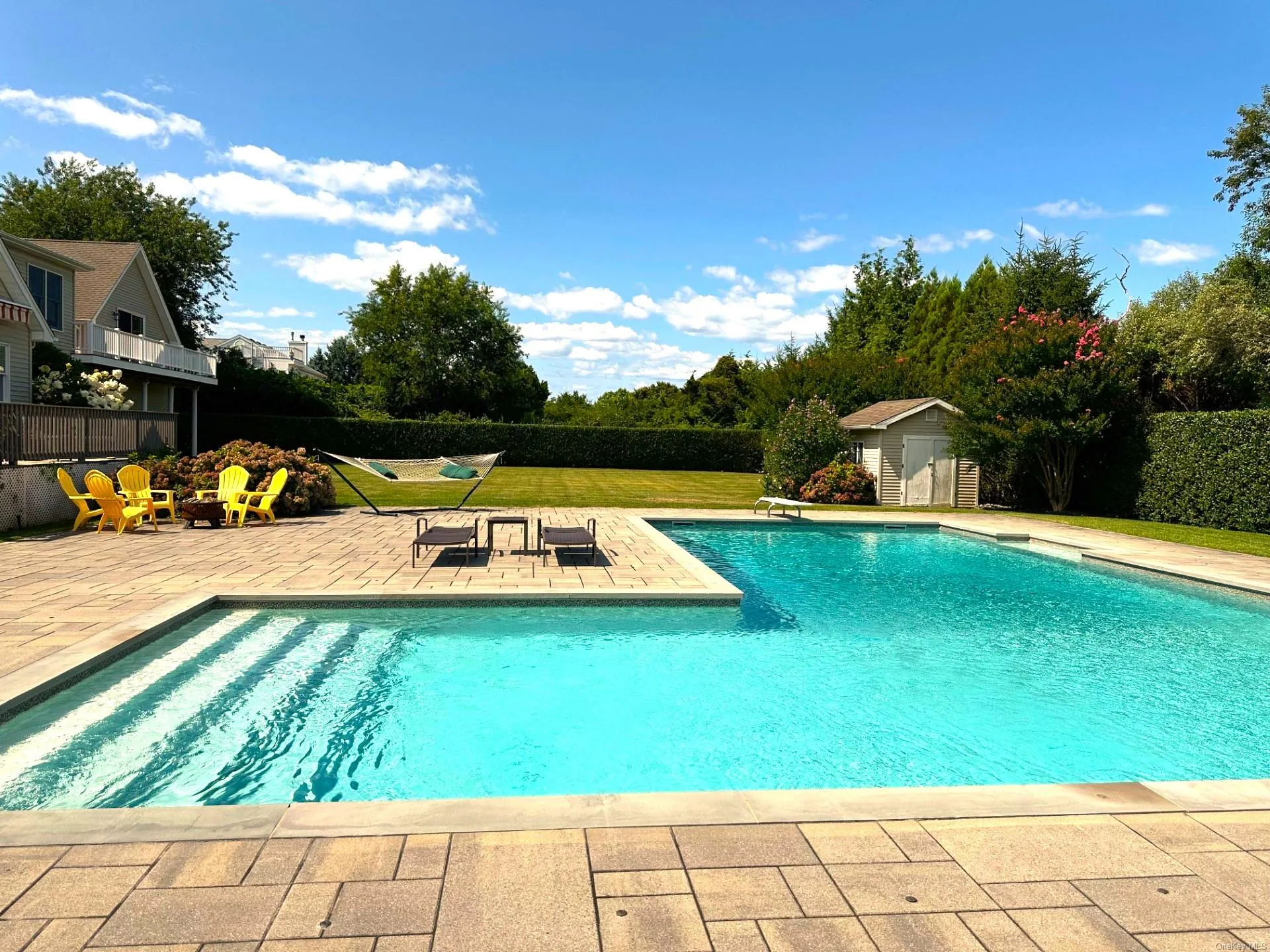 View of swimming pool with a fenced in pool, an outdoor structure, a patio area, fence, and a storage unit View of swimming pool with a fenced in pool, an outdoor structure, a patio area, fence, and a storage unit