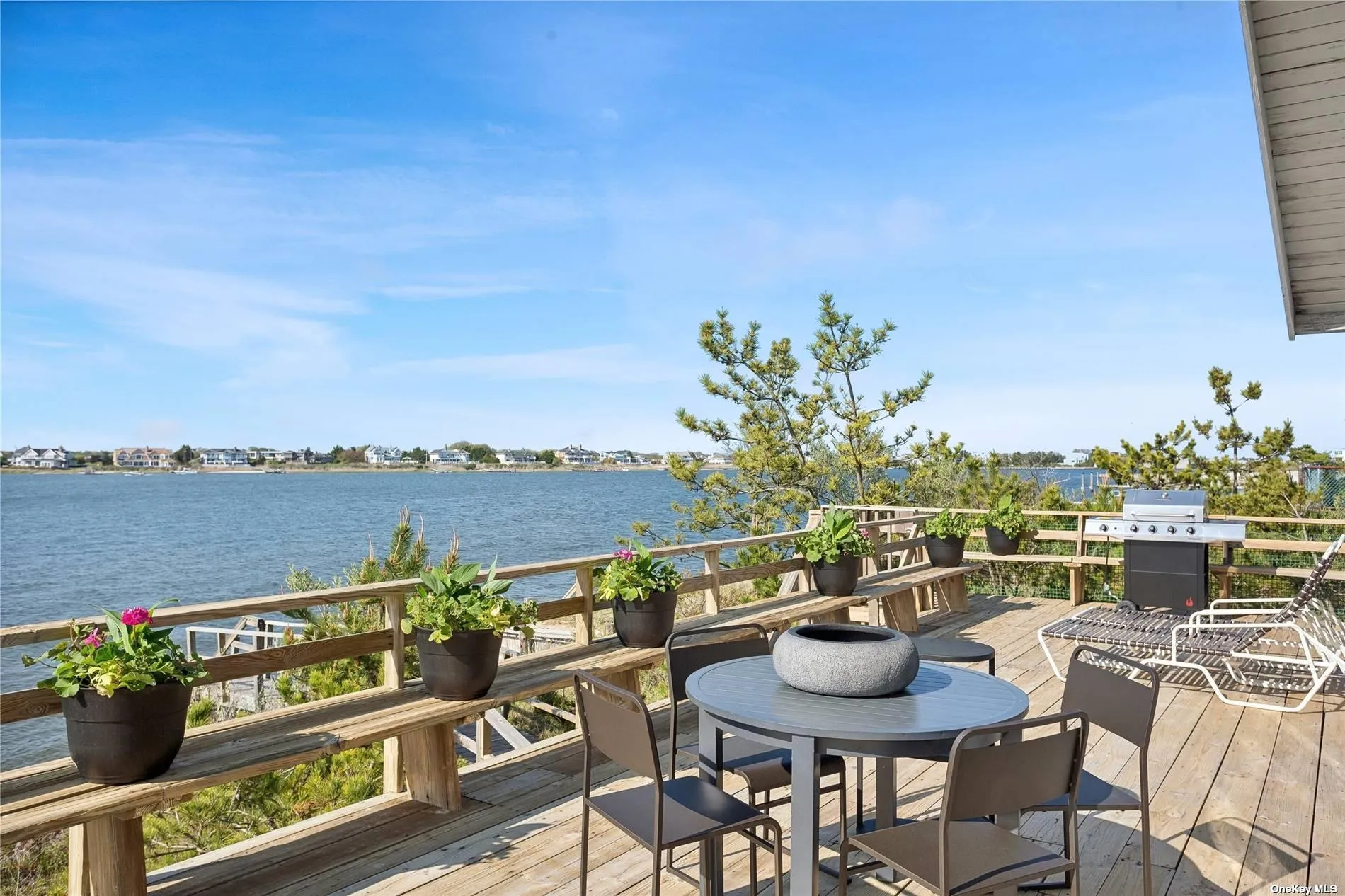 Directly on Moriches Bay, with huge deck, and Atlantic Ocean access across Dune Road Directly on Moriches Bay, with huge deck, and Atlantic Ocean access across Dune Road