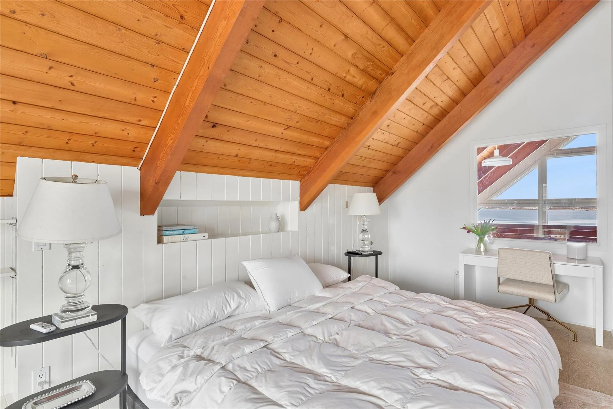 Upper level bedroom with private bath, balcony and water views Upper level bedroom with private bath, balcony and water views