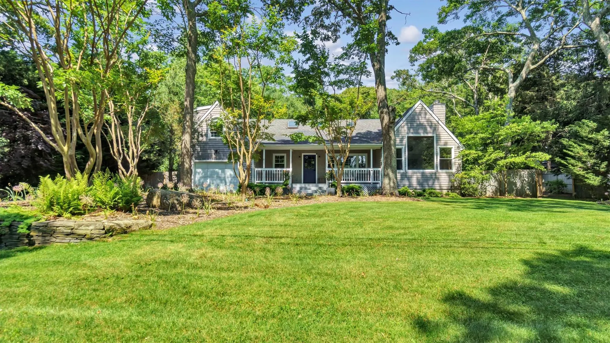 View of front of home with spacious lawn. View of front of home with spacious lawn.