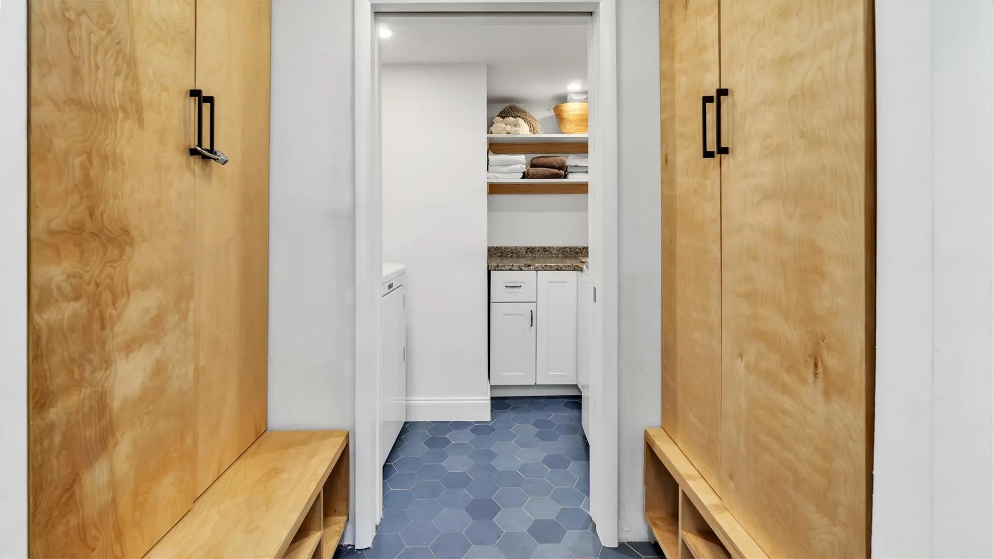 Mudroom featuring dark patterned flooring. Mudroom featuring dark patterned flooring.