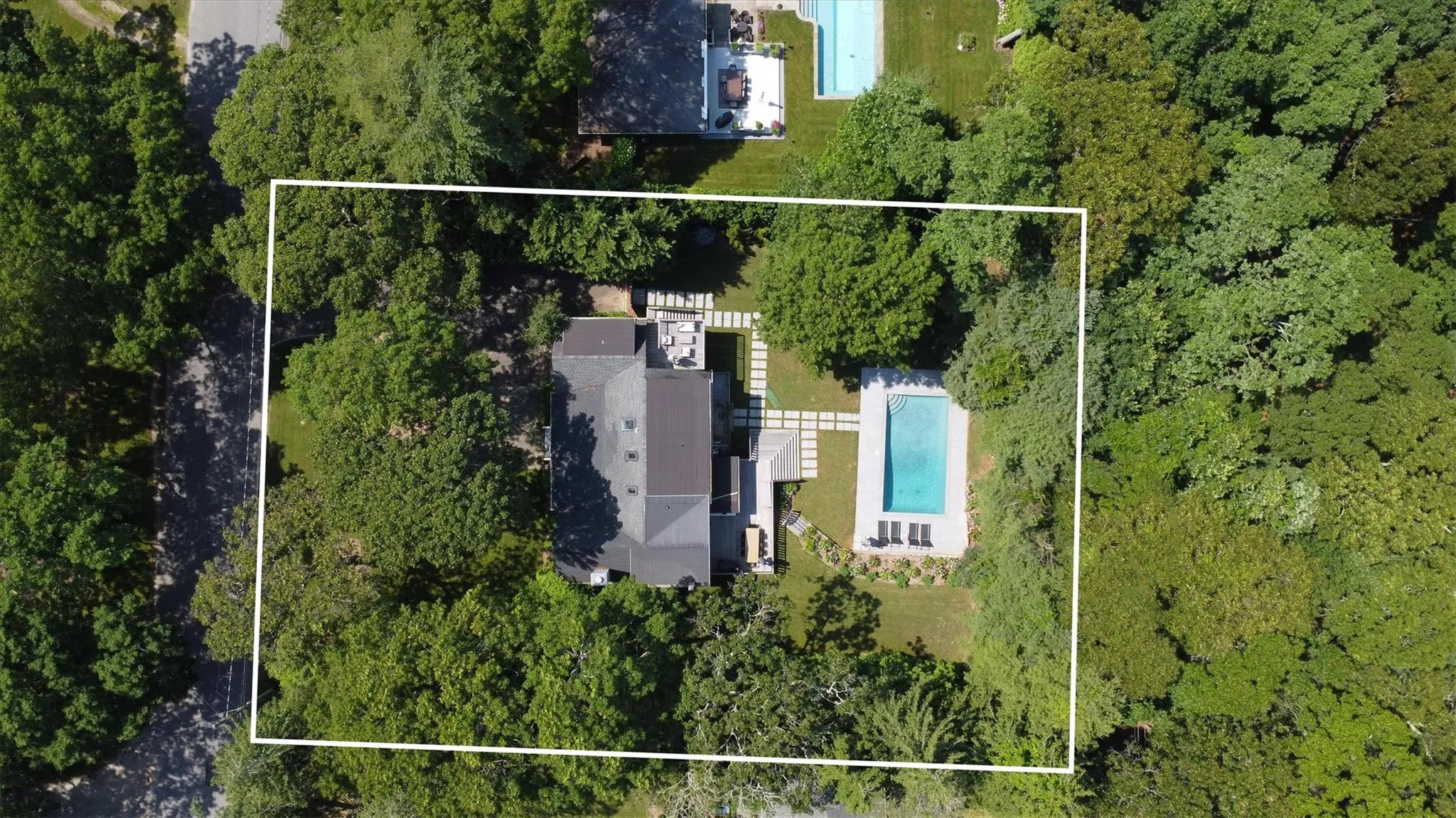 Aerial view of property's location with a pool area and property parcel outlined. Aerial view of property's location with a pool area and property parcel outlined.
