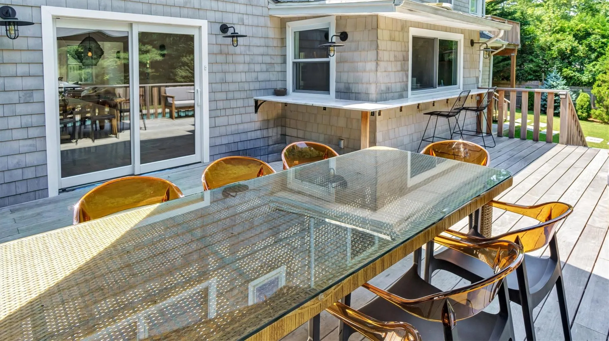 Wooden deck with outdoor dining area. Wooden deck with outdoor dining area.