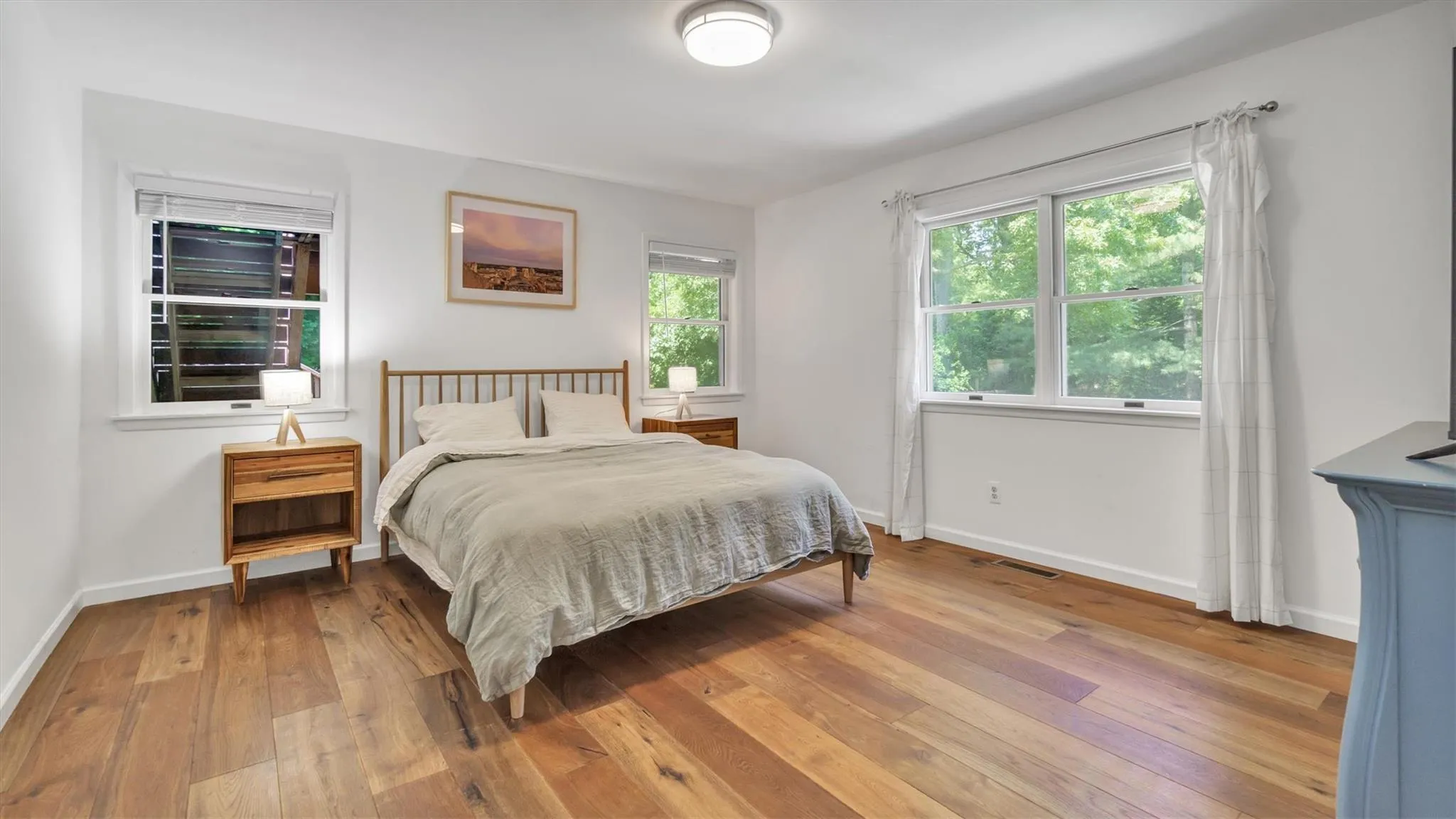 Primary Bedroom with wood-type flooring. Primary Bedroom with wood-type flooring.