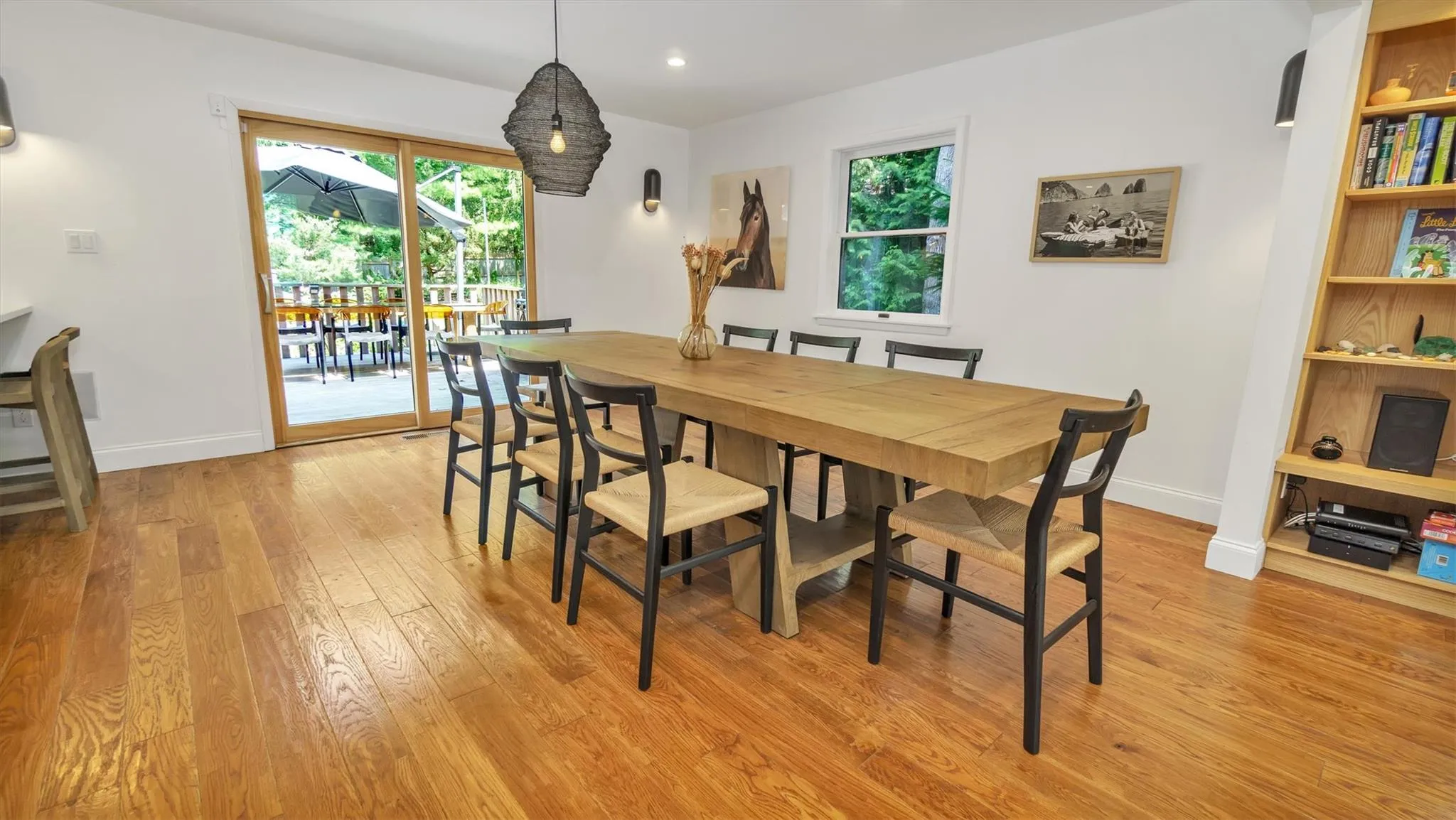 Dining space with light wood finished floors, and recessed lighting Dining space with light wood finished floors, and recessed lighting