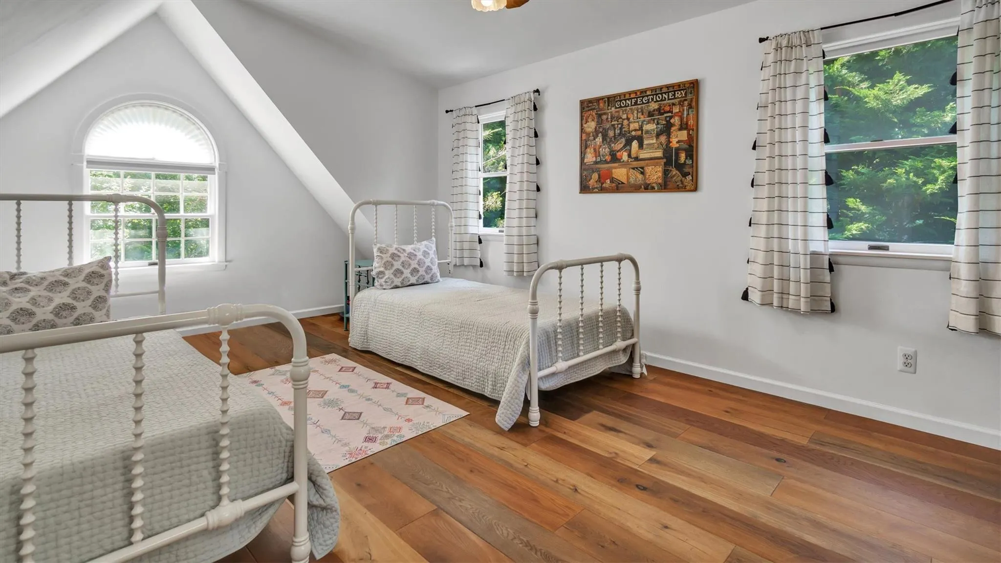Bedroom with wood-type flooring, and high ceiling. Bedroom with wood-type flooring, and high ceiling.