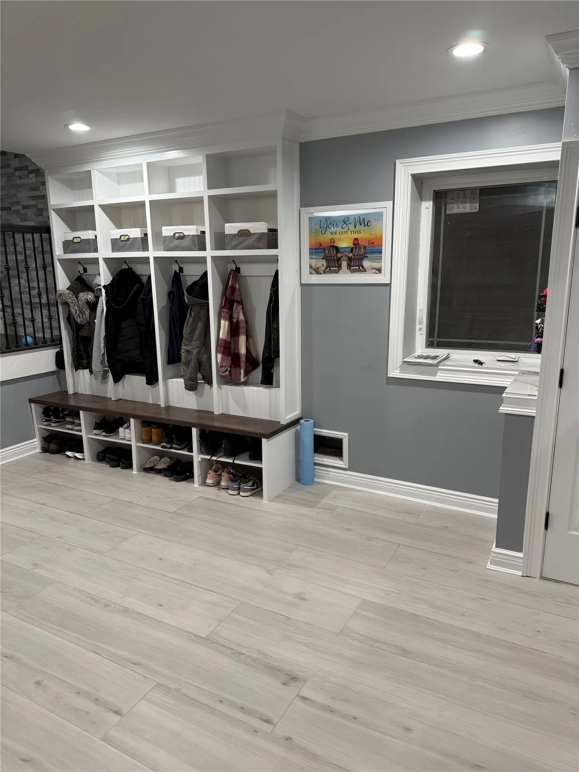 Mudroom featuring crown molding and light hardwood / wood-style flooring Mudroom featuring crown molding and light hardwood / wood-style flooring