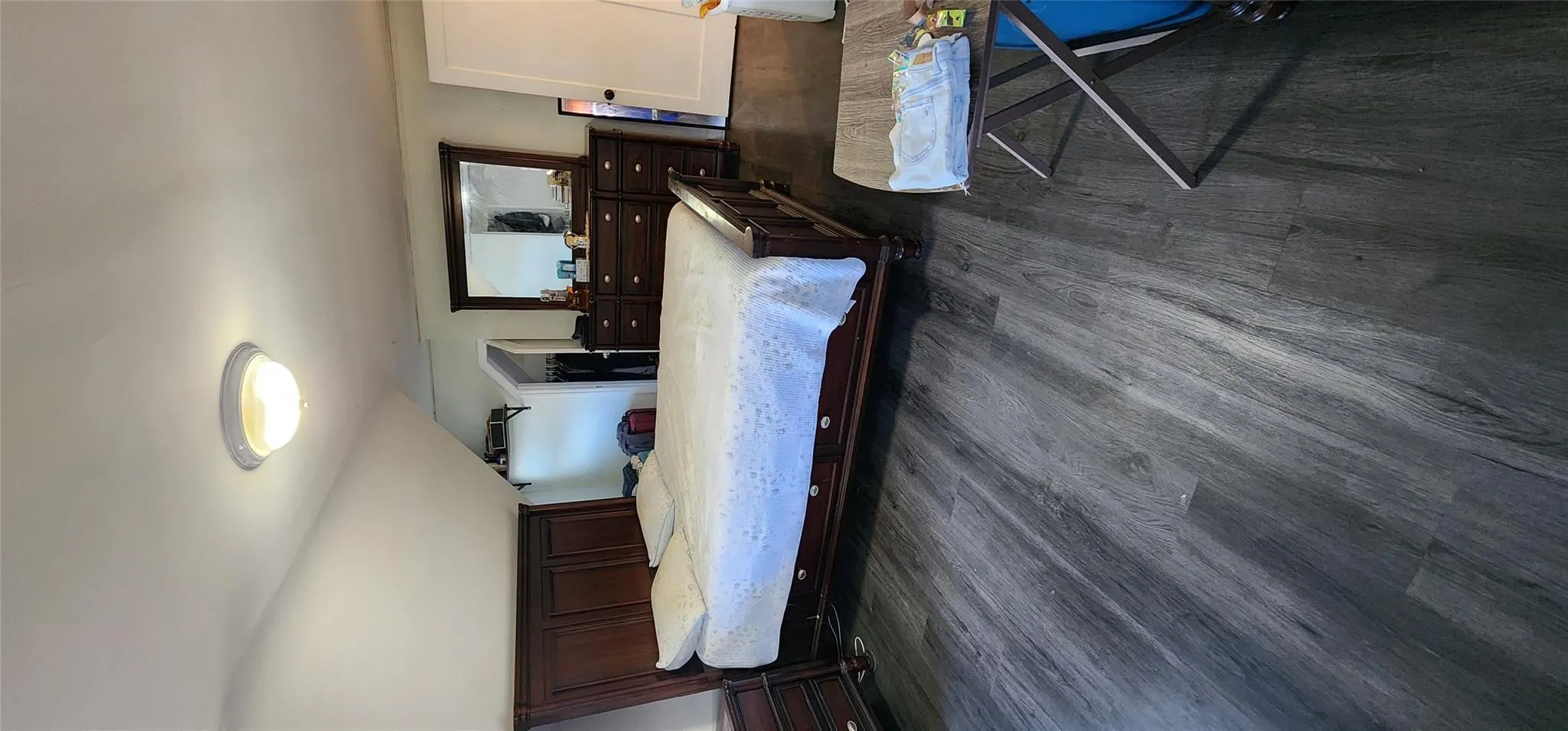 Bedroom featuring dark wood-style flooring Bedroom featuring dark wood-style flooring