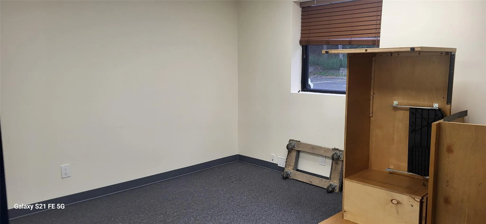 Carpeted empty room featuring baseboards Carpeted empty room featuring baseboards