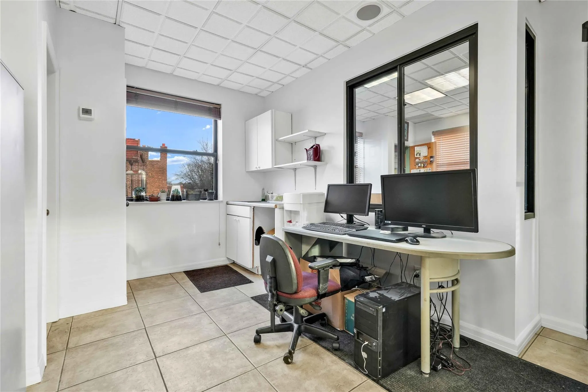 Office featuring a drop ceiling Office featuring a drop ceiling