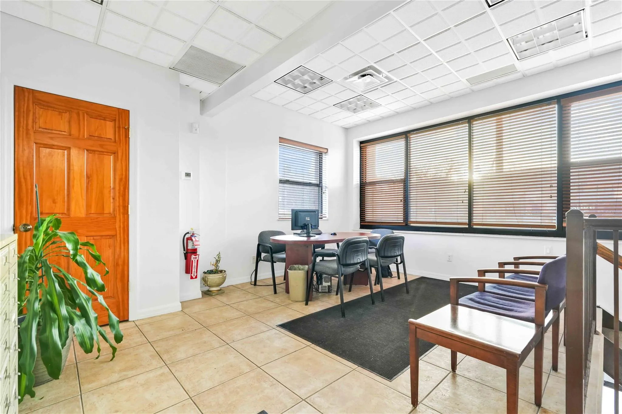 Office area featuring a drop ceiling Office area featuring a drop ceiling