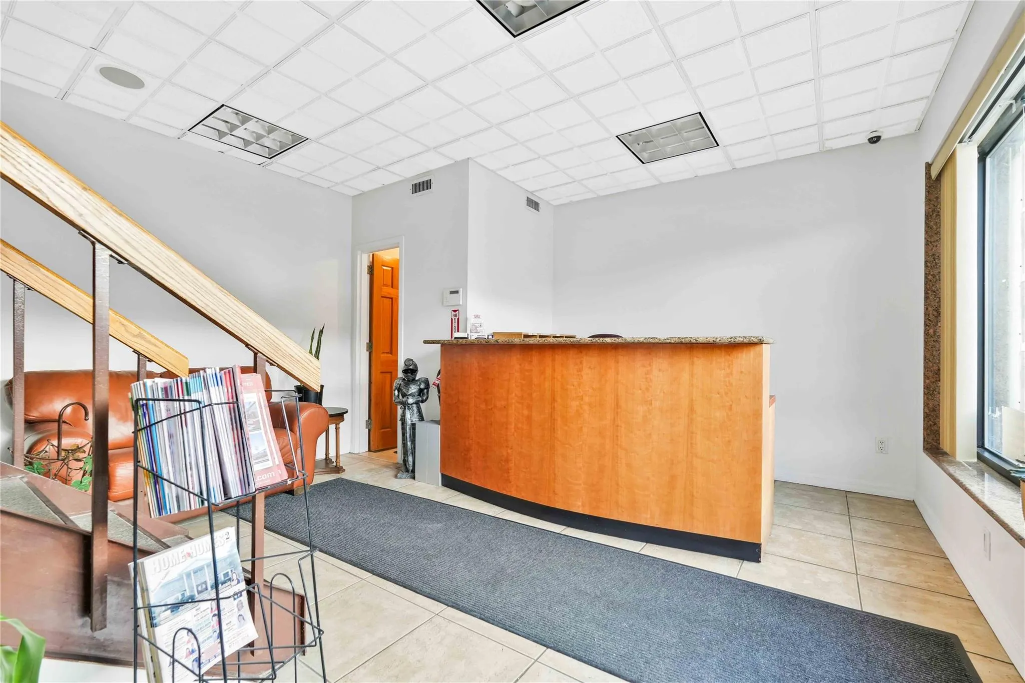 Reception area featuring a drop ceiling Reception area featuring a drop ceiling