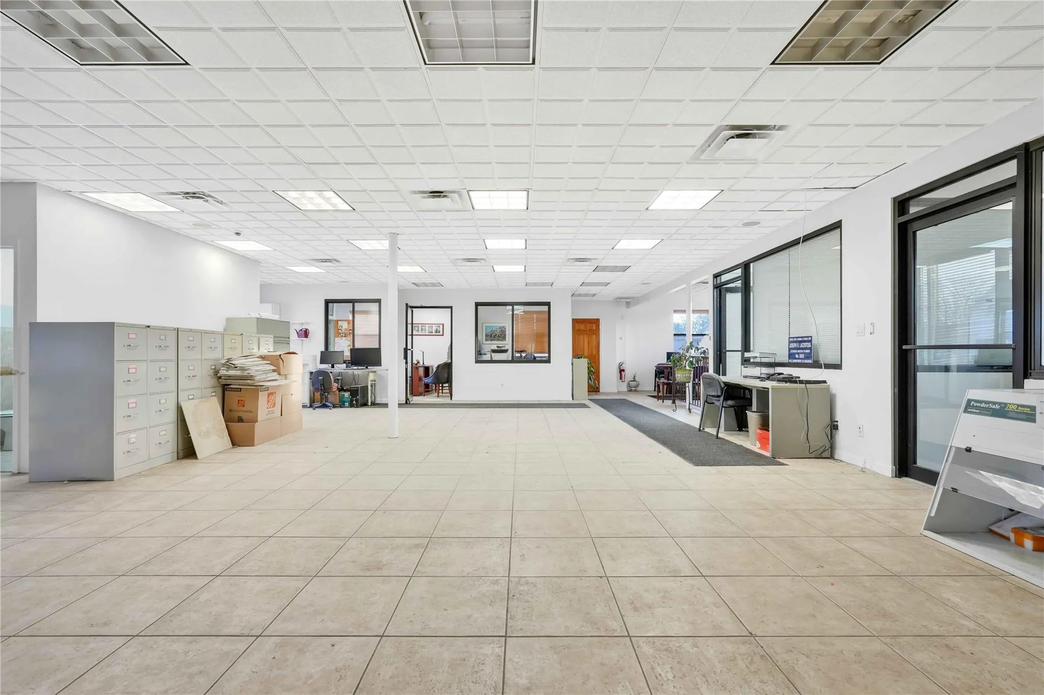 Misc room featuring a drop ceiling Misc room featuring a drop ceiling