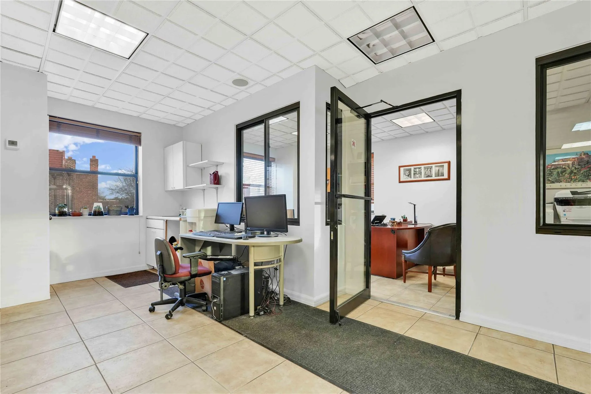 Home office featuring healthy amount of natural light and a paneled ceiling Home office featuring healthy amount of natural light and a paneled ceiling