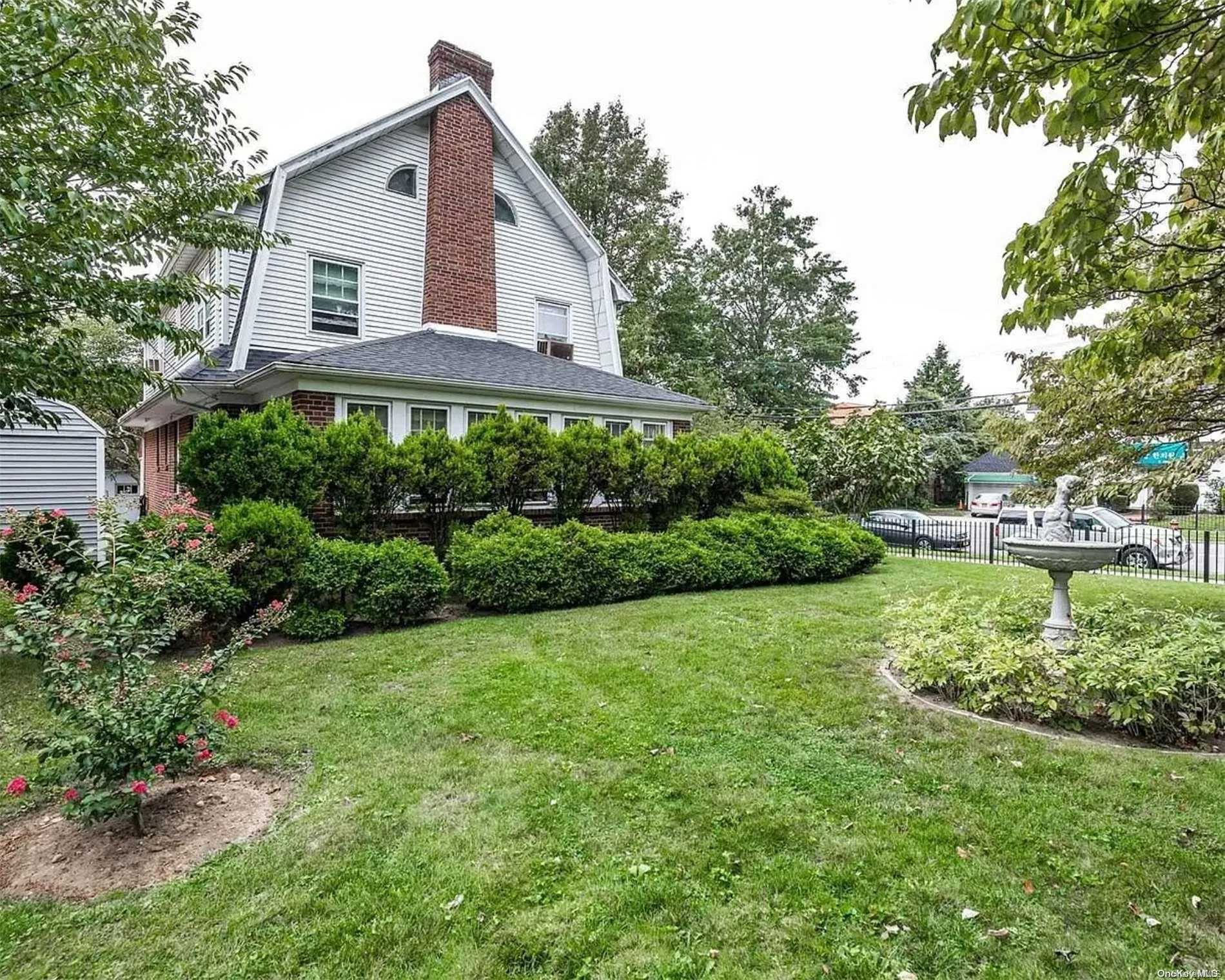 The expansive, fenced-in yard features lovely gardens The expansive, fenced-in yard features lovely gardens