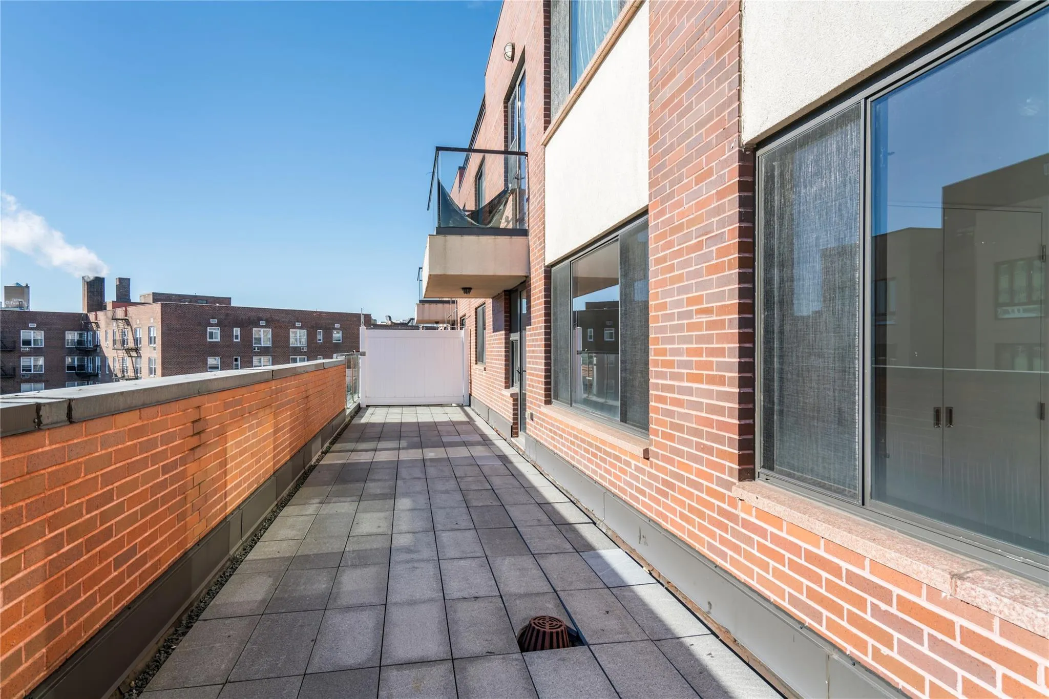 View of patio with a balcony View of patio with a balcony