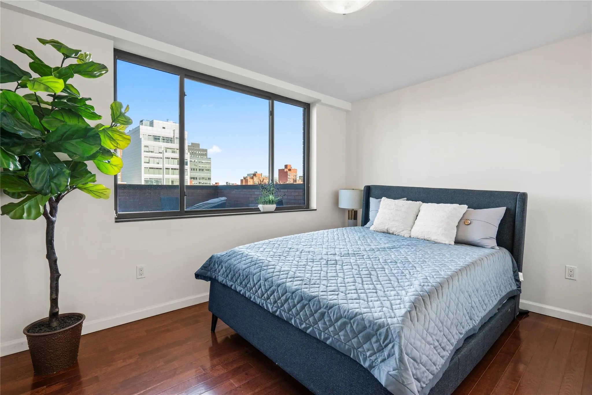Bedroom with dark hardwood / wood-style flooring Bedroom with dark hardwood / wood-style flooring