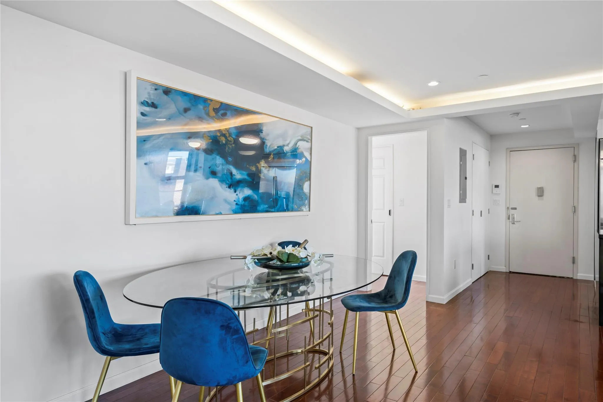 Dining room with dark hardwood / wood-style flooring and electric panel Dining room with dark hardwood / wood-style flooring and electric panel