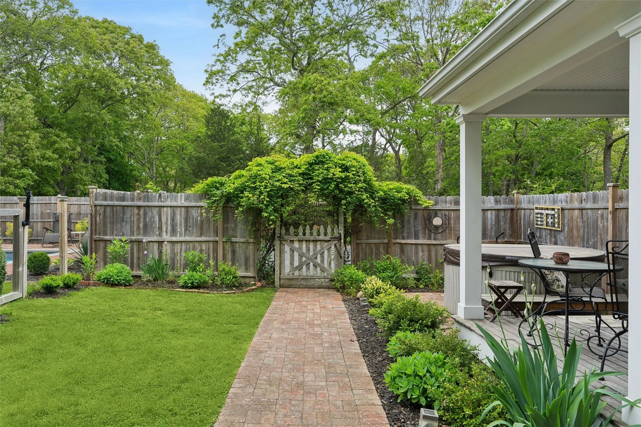 Fenced backyard with a gate Fenced backyard with a gate