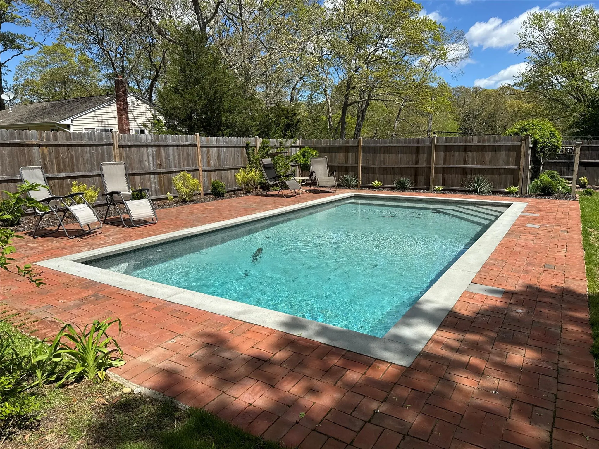 View of swimming pool with a patio area and a fenced backyard View of swimming pool with a patio area and a fenced backyard