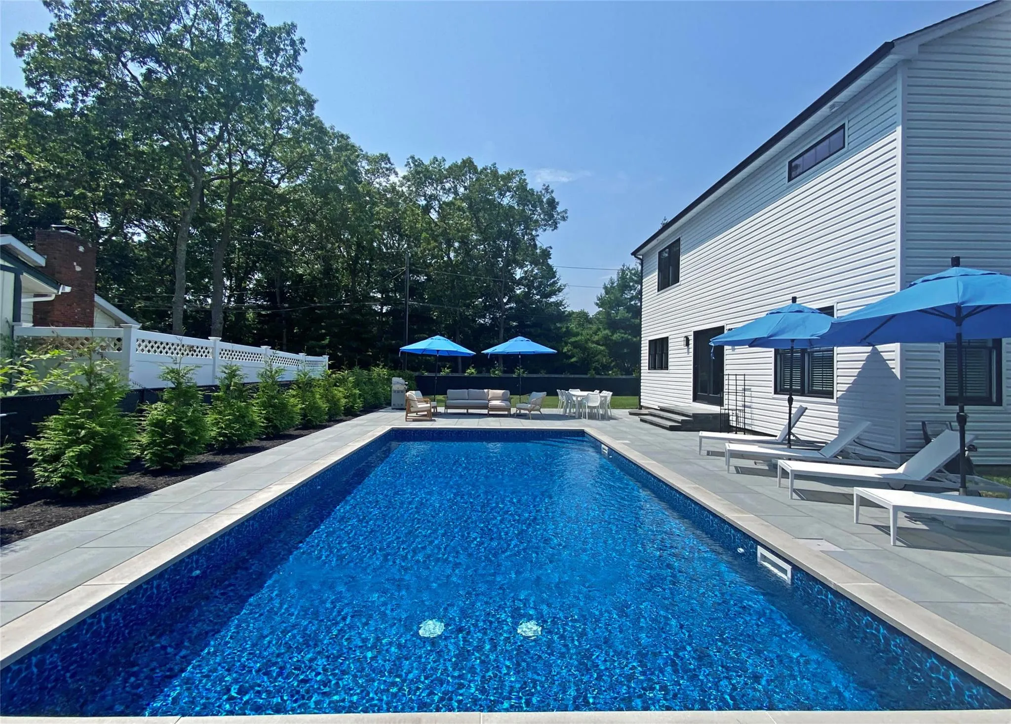 View of pool featuring an outdoor living space and a patio View of pool featuring an outdoor living space and a patio