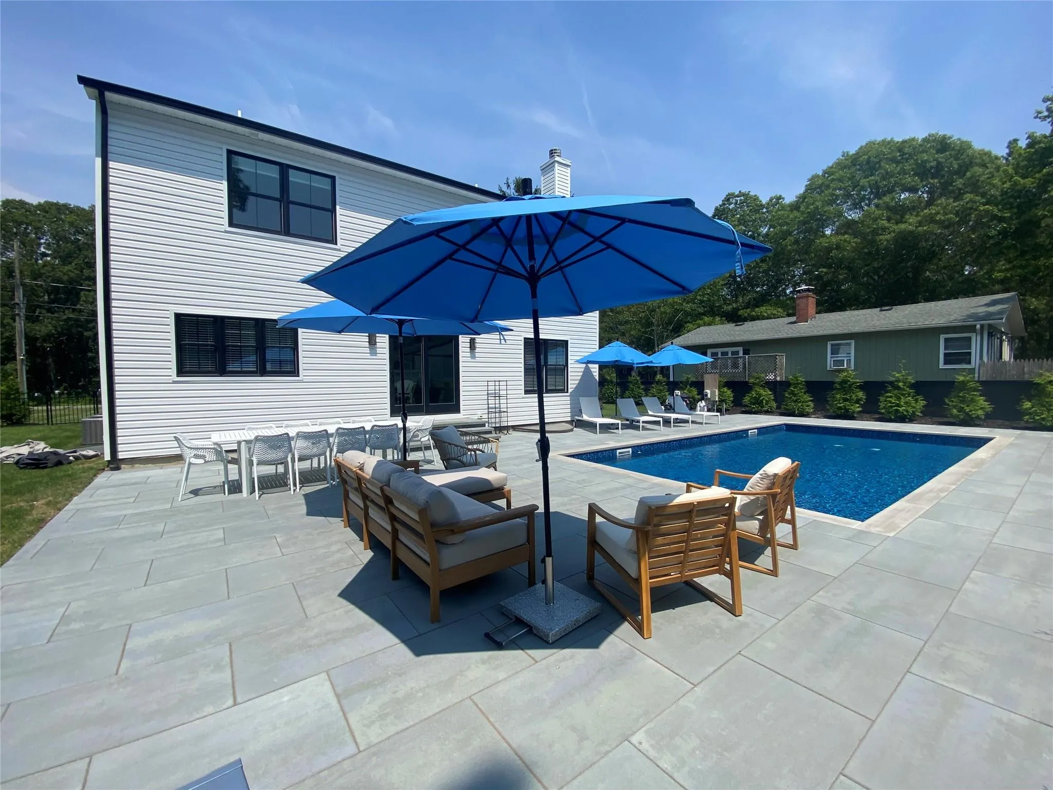 Outdoor pool featuring a patio and outdoor lounge area Outdoor pool featuring a patio and outdoor lounge area
