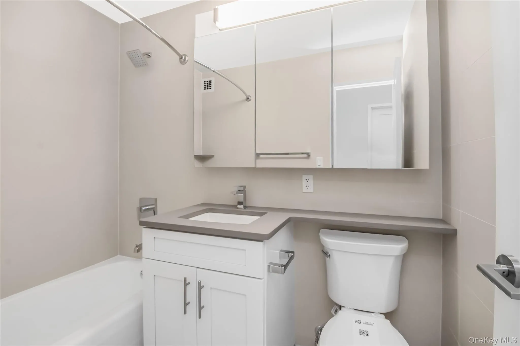 Bathroom with visible vents, toilet, and vanity Bathroom with visible vents, toilet, and vanity