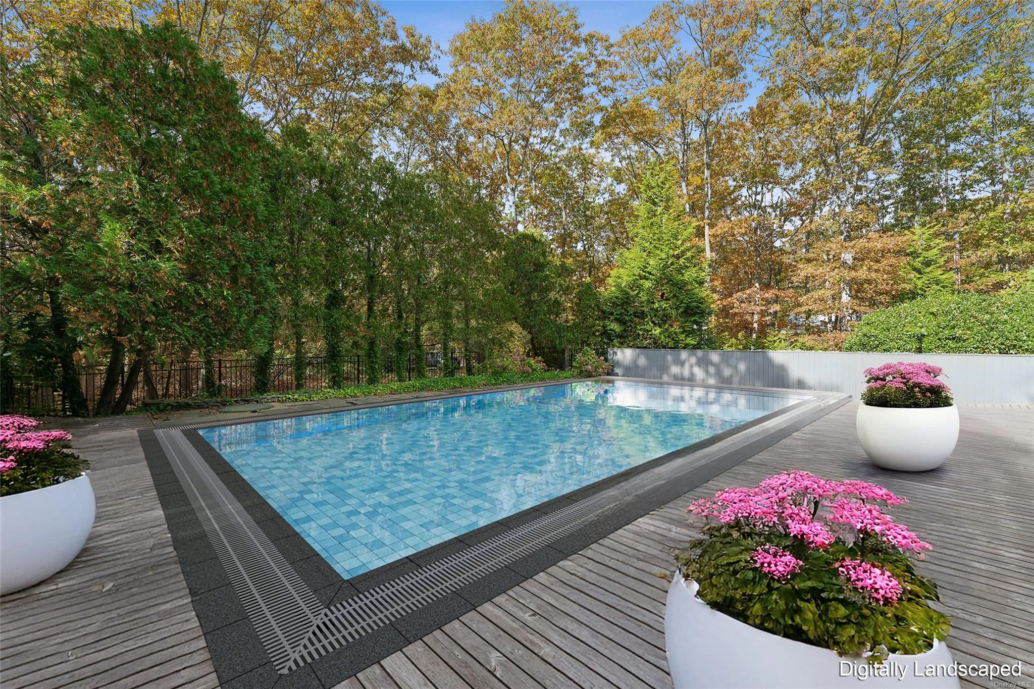 View of pool with a wooden deck View of pool with a wooden deck