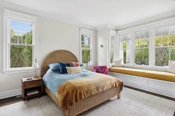 Bedroom featuring hardwood / wood-style floors and crown molding