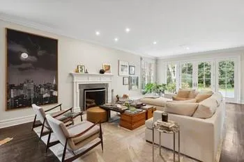 Living room featuring crown molding and hardwood / wood-style floors